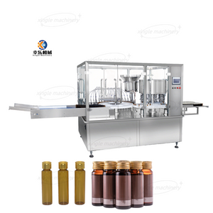 Machine automatique de remplissage et de scellage de flacons de liquides pharmaceutiques