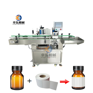 Machine d'étiquetage de bouteilles rondes à positionnement entièrement automatique