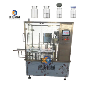 Machine de remplissage et de capsulage de flacons liquides cosmétiques à double tête