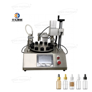 Machine rotative de remplissage et de capsulage de petites bouteilles de parfum