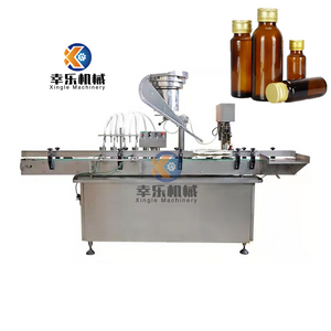 Machine de remplissage et de capsulage automatique de flacons en verre de produits biologiques